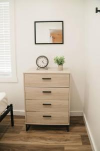 a dresser with a clock sitting on top of it at Hartman Center Campground in Milroy