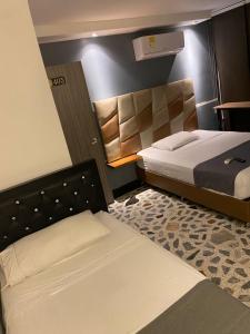 HOTEl AIRPORT PEREIRA客房内的一张或多张床位