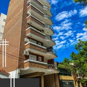 a tall building with balconies on the side of it at Departamento Good Vibes 2 in Paraná +2 photos