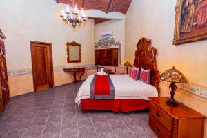 Ένα ή περισσότερα κρεβάτια σε δωμάτιο στο HOTEL & SPA HACIENDA TRES VIDAS