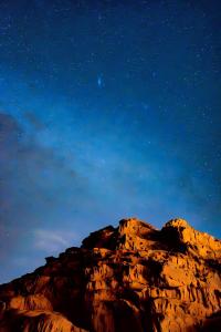 a mountain under a starry sky at night at Rest luxury camp in Disah