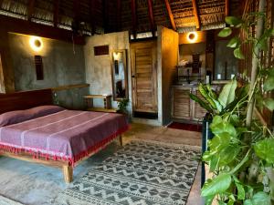 a bedroom with a bed in a room at Casa Monika penthouse room in Brisas de Zicatela