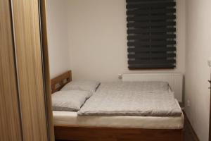 Postel nebo postele na pokoji v ubytování Apartmány 264