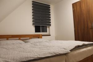 Postel nebo postele na pokoji v ubytování Apartmány 264