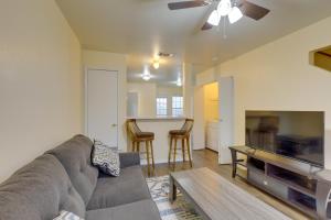 a living room with a couch and a table at Quiet Killeen Townhome, 5 Mi to Fort Hood Shopping in Killeen