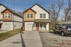 a house with a car parked in a driveway at Pet-Friendly Gallatin Home with Deck, 1 Mi to Town! in Gallatin