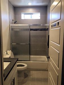 a small bathroom with a toilet and a sink at Shared Living Los Angeles (South K-Town) in Los Angeles