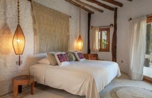 Postel nebo postele na pokoji v ubytování Mawimbi Boutique Hotel