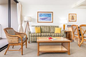 a living room with a couch and chairs and a table at Cozy & Diamond Head View at Waikiki with Parking in Honolulu