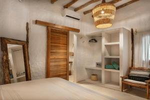 Postel nebo postele na pokoji v ubytování Mawimbi Boutique Hotel