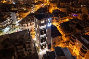 an aerial view of a city at night at SIGMA Luxury Apartments & Suites in Thessaloniki