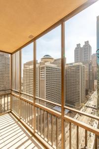 a balcony with a view of the city at High Rise Downtown Condo With Skyline View in Atlanta