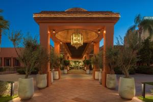 a lobby of a resort with a chandelier at Le Meridien N'fis in Marrakech