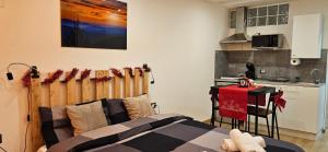 a bedroom with a bed and a small kitchen at il Cortiletto 2 apartments in Calolziocorte