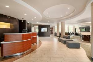 a lobby of a hotel with a reception desk at Courtyard Ewing Hopewell in Ewing