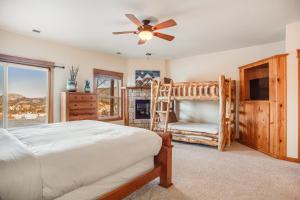a bedroom with a bed and a tv at Estes Park Escape - Permit #6071 in Estes Park
