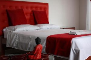 Voodi või voodid majutusasutuse Hotel Balcón Plaza toas