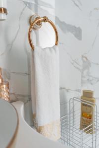 a towel holder in a bathroom with a towel at Homes of Ace Diamond in Pretoria