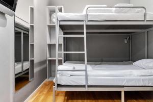 a dorm room with bunk beds in it at Sure Hotel by Best Western Stockholm Alvsjo in Stockholm