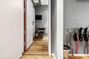 a hallway leading to a room with a desk at Sure Hotel by Best Western Stockholm Alvsjo in Stockholm