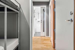 a bathroom with a walk in shower next to a hallway at Sure Hotel by Best Western Stockholm Alvsjo in Stockholm
