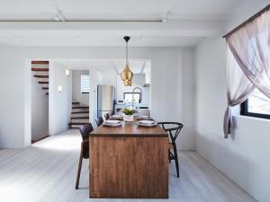 a kitchen and dining room with a wooden table and chairs at &MOON Noa - Vacation STAY 72009v in Hayama