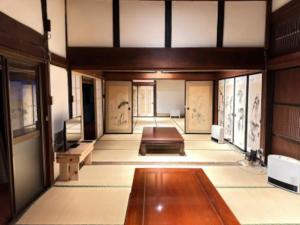 an empty room with paintings on the walls at Potato mura house tatara - Vacation STAY 90000v in Nagano
