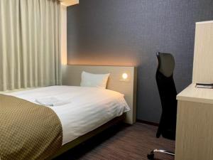 Кровать или кровати в номере Hotel Sunny Inn - Vacation STAY 20455v