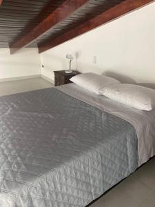 Krevet ili kreveti u jedinici u okviru objekta Loft na Praia dos Amores
