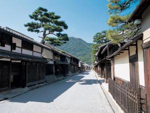 an empty street in an asian town with buildings at Daiichi Hotel - Vacation STAY 24289v in Omihachiman