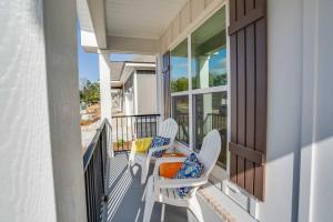a balcony with two chairs and a table at Citrus Cottage: Comfy - Hwy 10 - Peaceful Retreat in Tallahassee