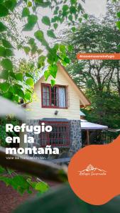 a house with a sign that reads refuge in la mormon at Refugio Invernalia in Las Trancas