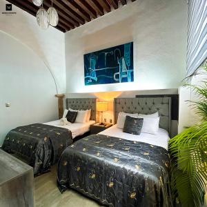 Postel nebo postele na pokoji v ubytování M Hoteles Concepto