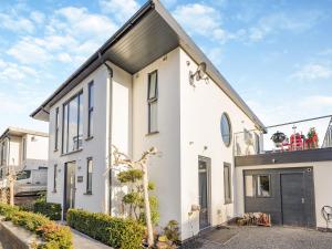 a white house with a black roof at The Brook - Uk45836 in Mathon