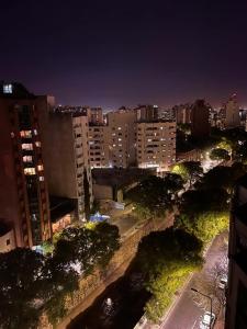 a view of a city at night with buildings at DEPARTAMENTO EN GUEMES CORDOBA in Córdoba