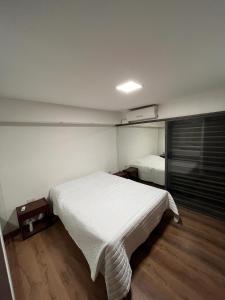 a bedroom with a large white bed in it at DEPARTAMENTO EN GUEMES CORDOBA in Córdoba