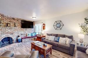 a living room with a couch and a fireplace at Bentons Oasis in Ventura