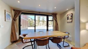 a dining room with a wooden table and chairs at 1849 Condos 103 home in Mammoth Lakes