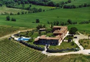 an aerial view of a house in the middle of a field at Relais Le Ginestre in Saturnia