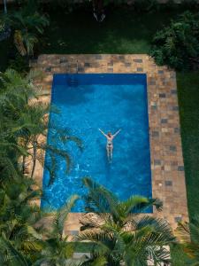 an overhead view of a person in a swimming pool at Brubru Lodge in Moshi