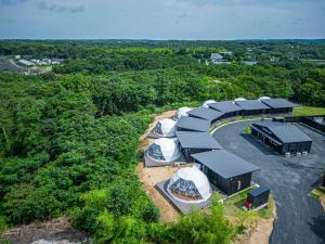 an overhead view of a group of tents in a field at THE GLAMPING PLAZA 伊勢志摩BASE in Ugata