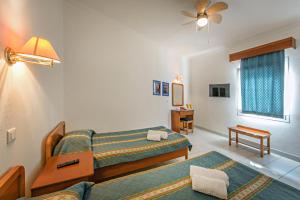 מיטה או מיטות בחדר ב-Lazaridis Luxury Studios & Apartments