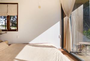 Postel nebo postele na pokoji v ubytování Dalaha Retreat