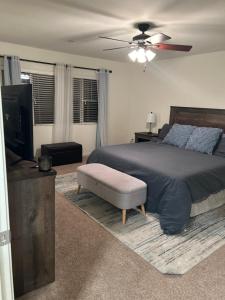 a bedroom with a bed and a ceiling fan at 3238 Correll Way in Rancho Cordova