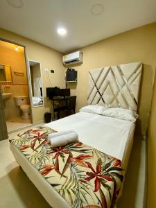 A bed or beds in a room at Casa Mango