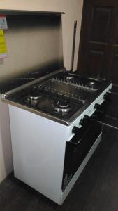 a stove top oven sitting in a kitchen at Nuruls Homestay in Kuala Terengganu