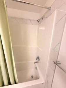 a bathroom with a shower with a shower at Somy Suite - Cozy 2bedrom with two queens bed and free street parking in Calgary