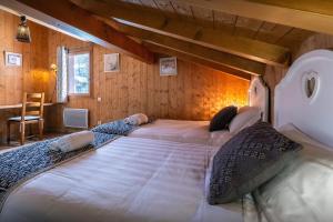 Кровать или кровати в номере Chalet Timothy - OVO Network