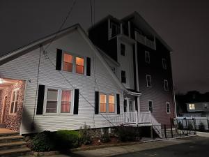 a house with its lights on in the window at Private bungalow in Providence