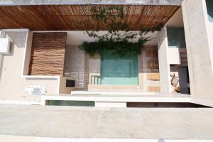 a building with a bench in front of a window at Akbal Tulum in Tulum